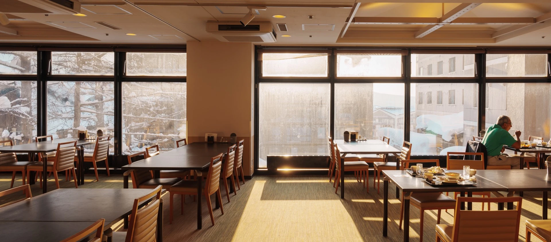 Dining room with tables and chairs supplied by GOLDEN AGE HOUSING PRODUCTS