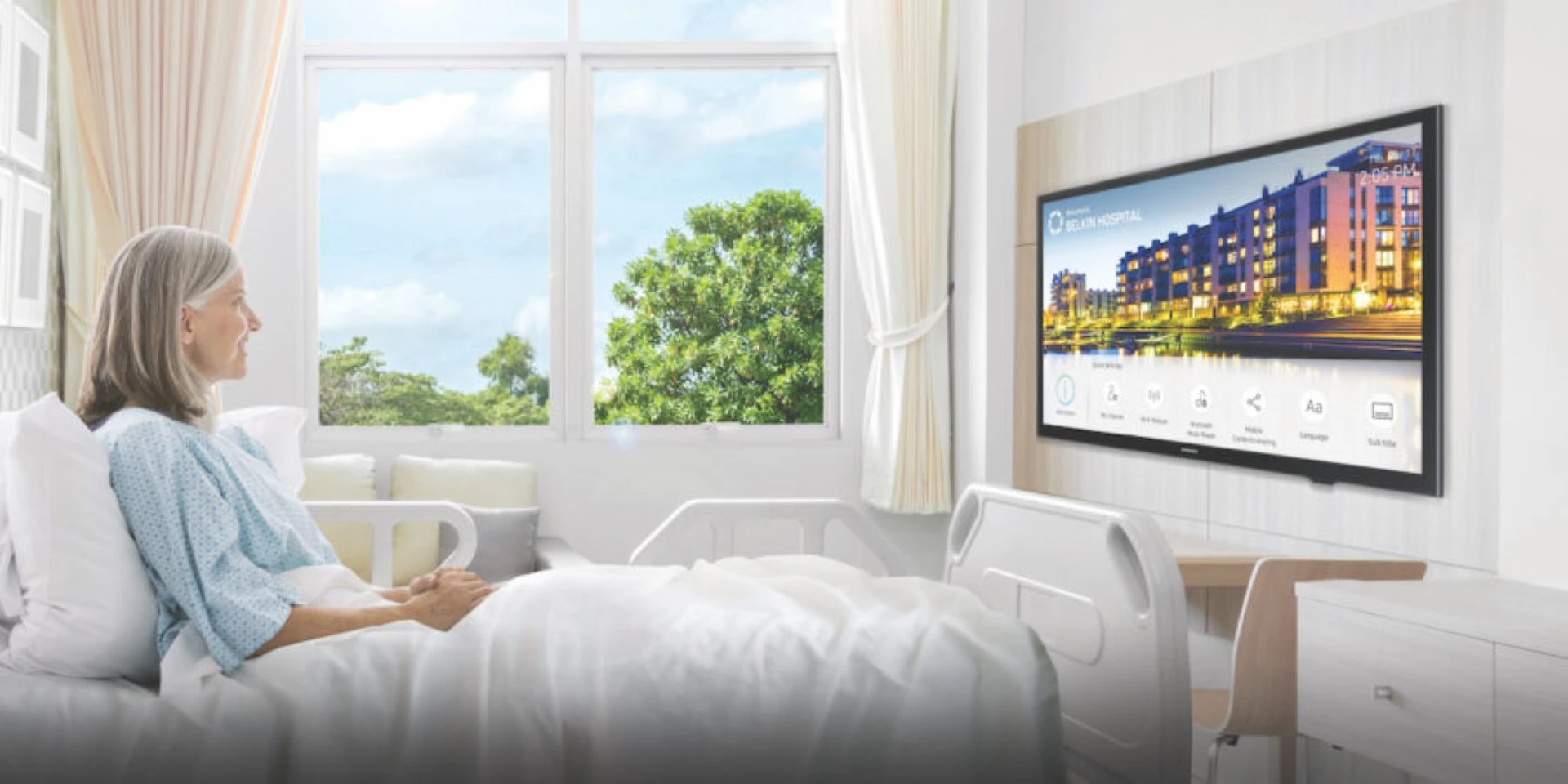 Lady in bed watching television supplied by GOLDEN AGE HOUSING PRODUCTS