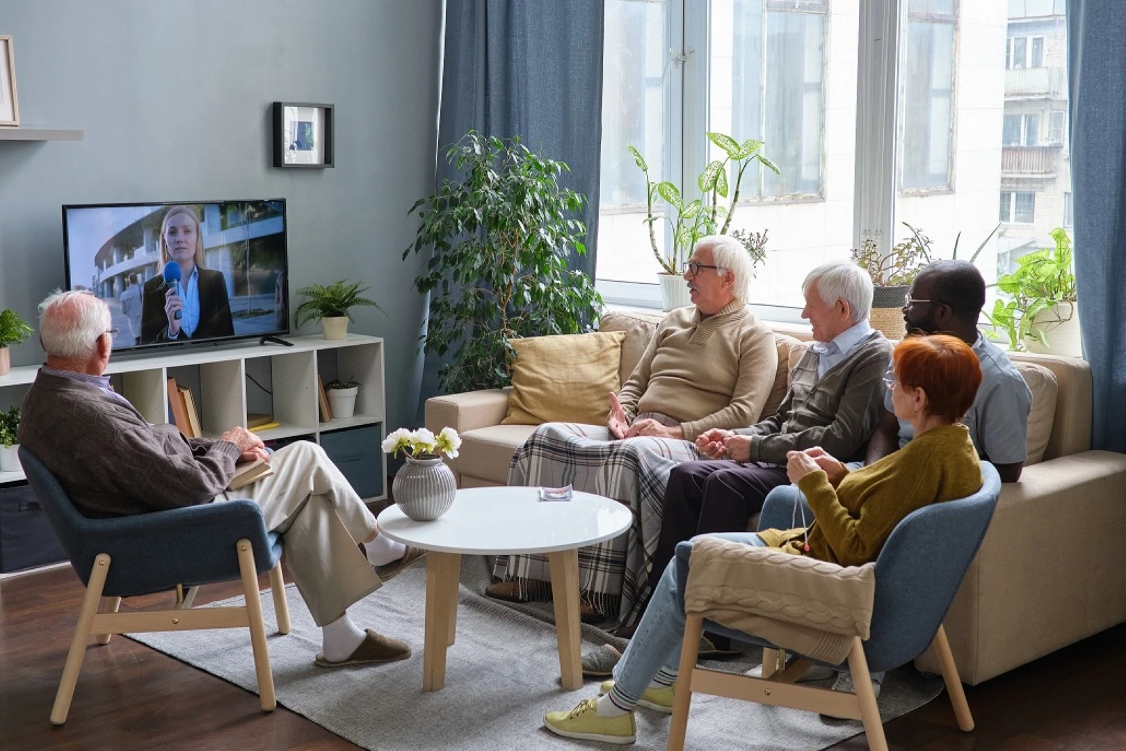 People watching TV in senior care which is supplied by GOLDEN AGE HOUSING PRODUCTS